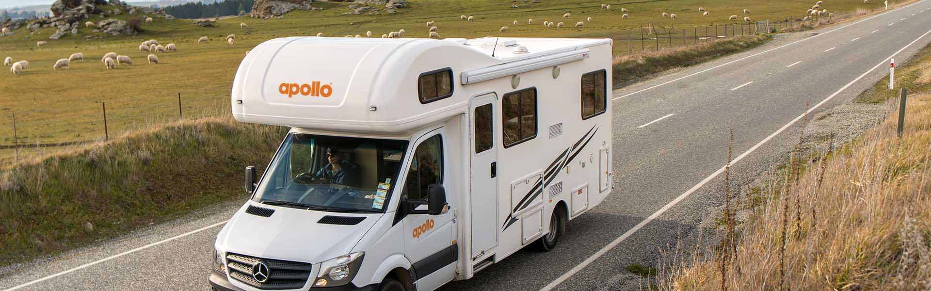 Apollo rental motorhome driving along New Zealand country side road